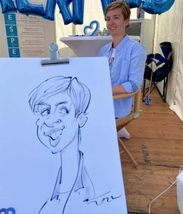 Karikaturen-malen-an-dem-Hermes-Stand-in-Magdeburg.