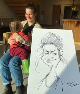 Schnellzeichner-mit-Karikaturen-an-der-Feier.